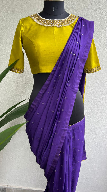 Purple soft jute saree with yellow JEWEL neck hand work blouse