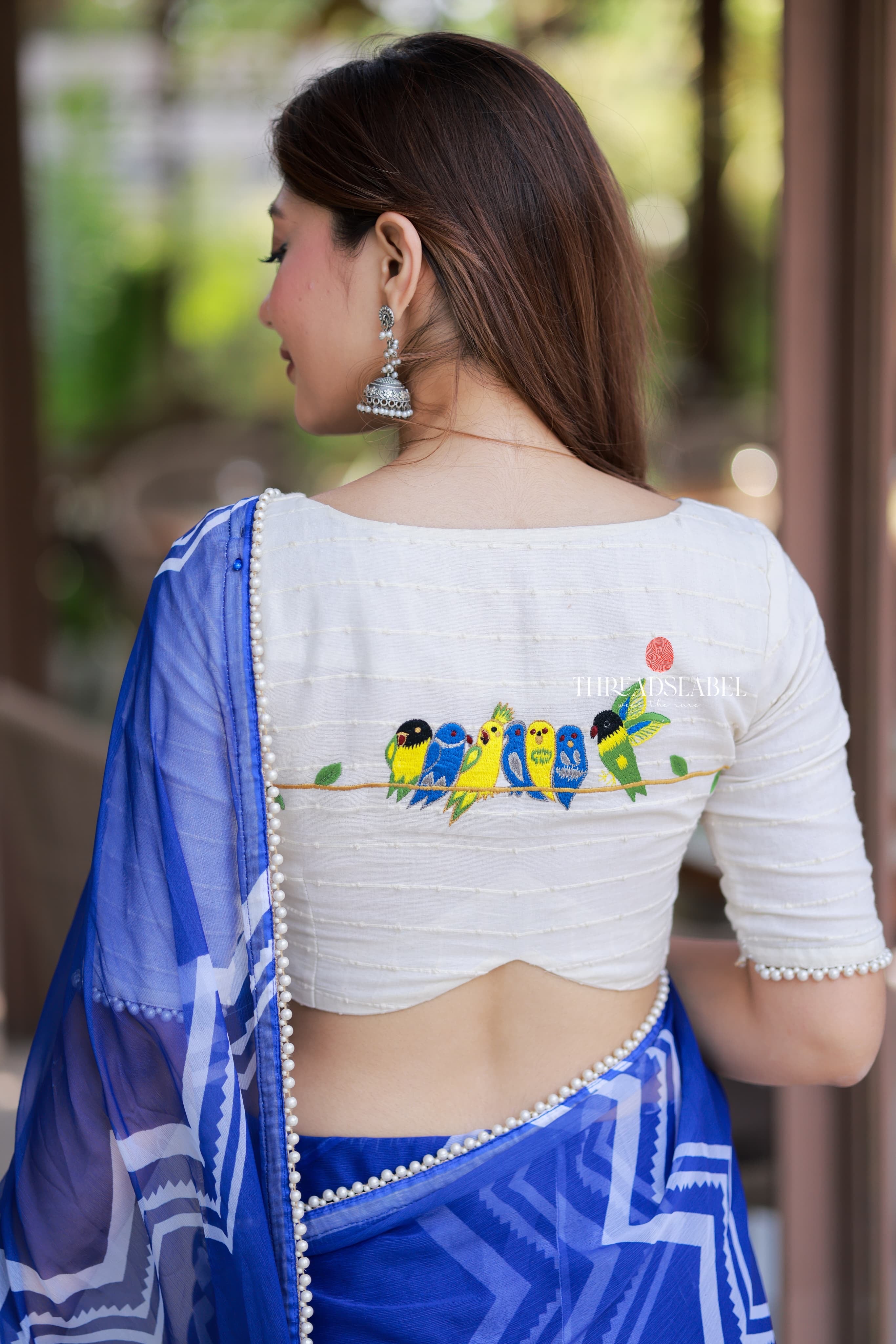 Blue chiffon saree with white embroidery blouse