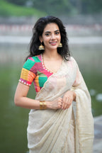 Beige georgette tissue saree with multi hand work blouse