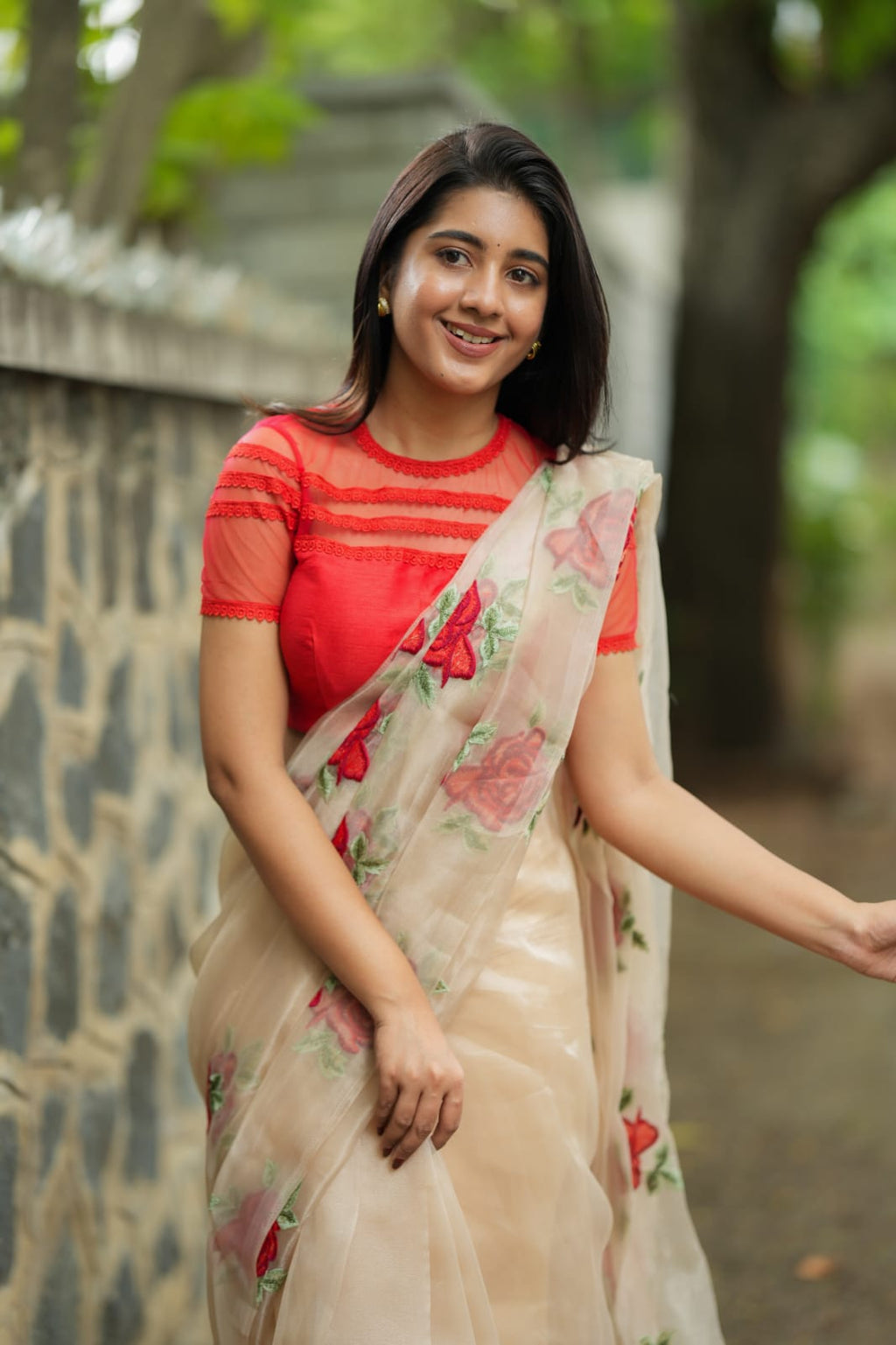 Glossy organza saree with red embroidery blouse