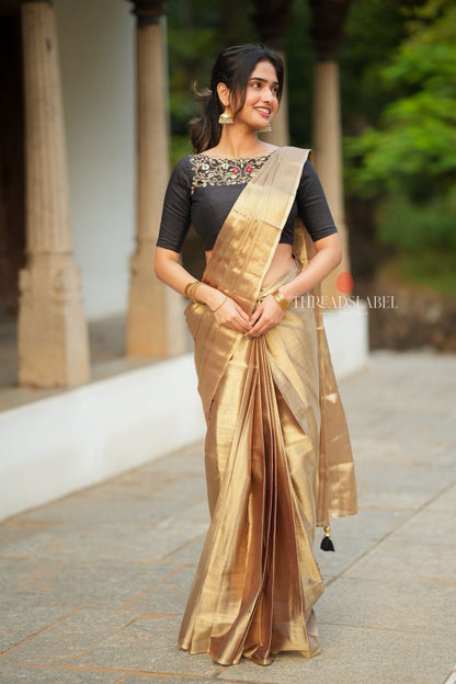 Golden tissue saree with black hand work blouse