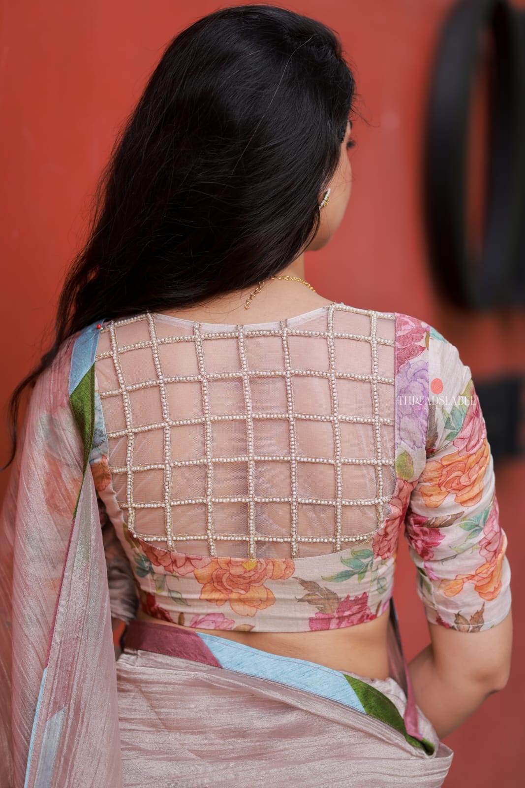 Dusty silver tissue saree with pearl hand work blouse