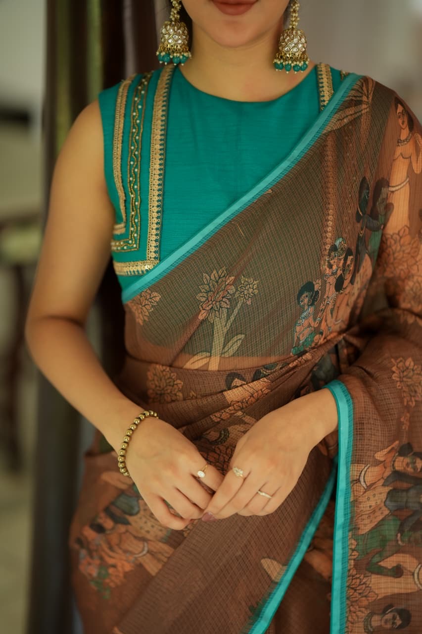 Brown kalamkari kota saree with blue hand work blouse
