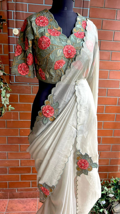 Half white textured organza saree with heavy handwork blouse