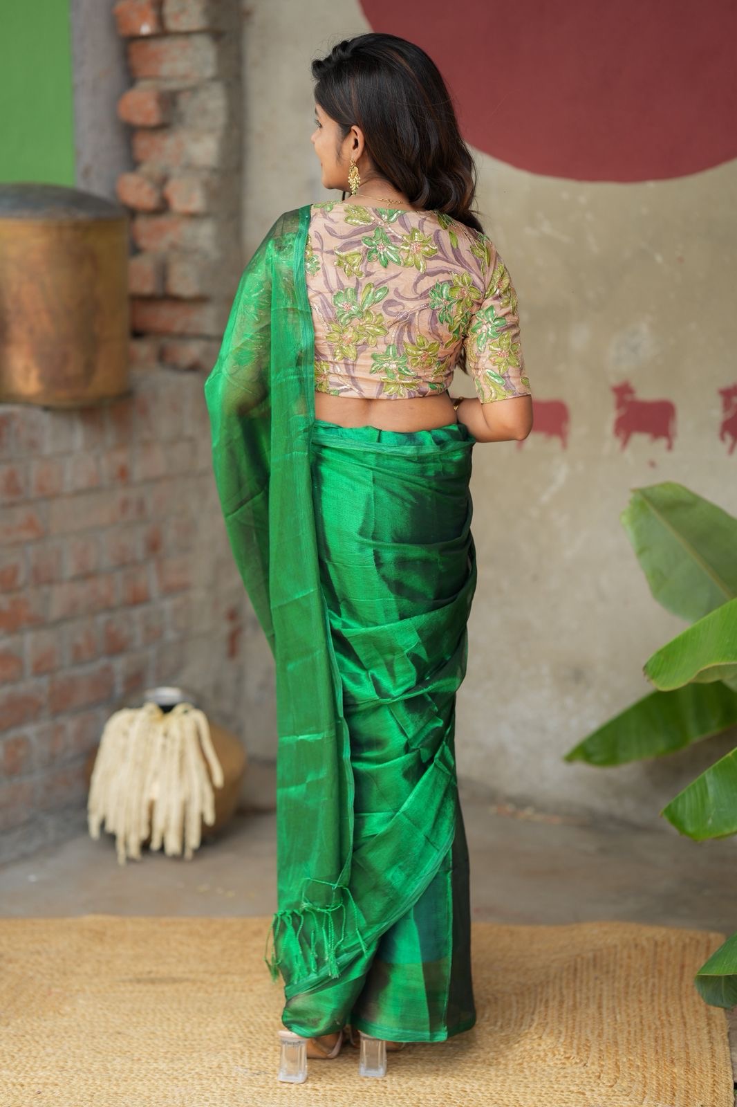 Green soft tissue saree with embroidered blouse