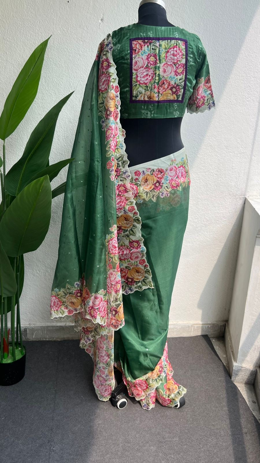 Green floral kota doria saree with patterned blouse