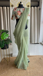 Light green tissue saree with mirror floral blouse
