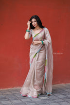 Dusty silver tissue saree with pearl hand work blouse
