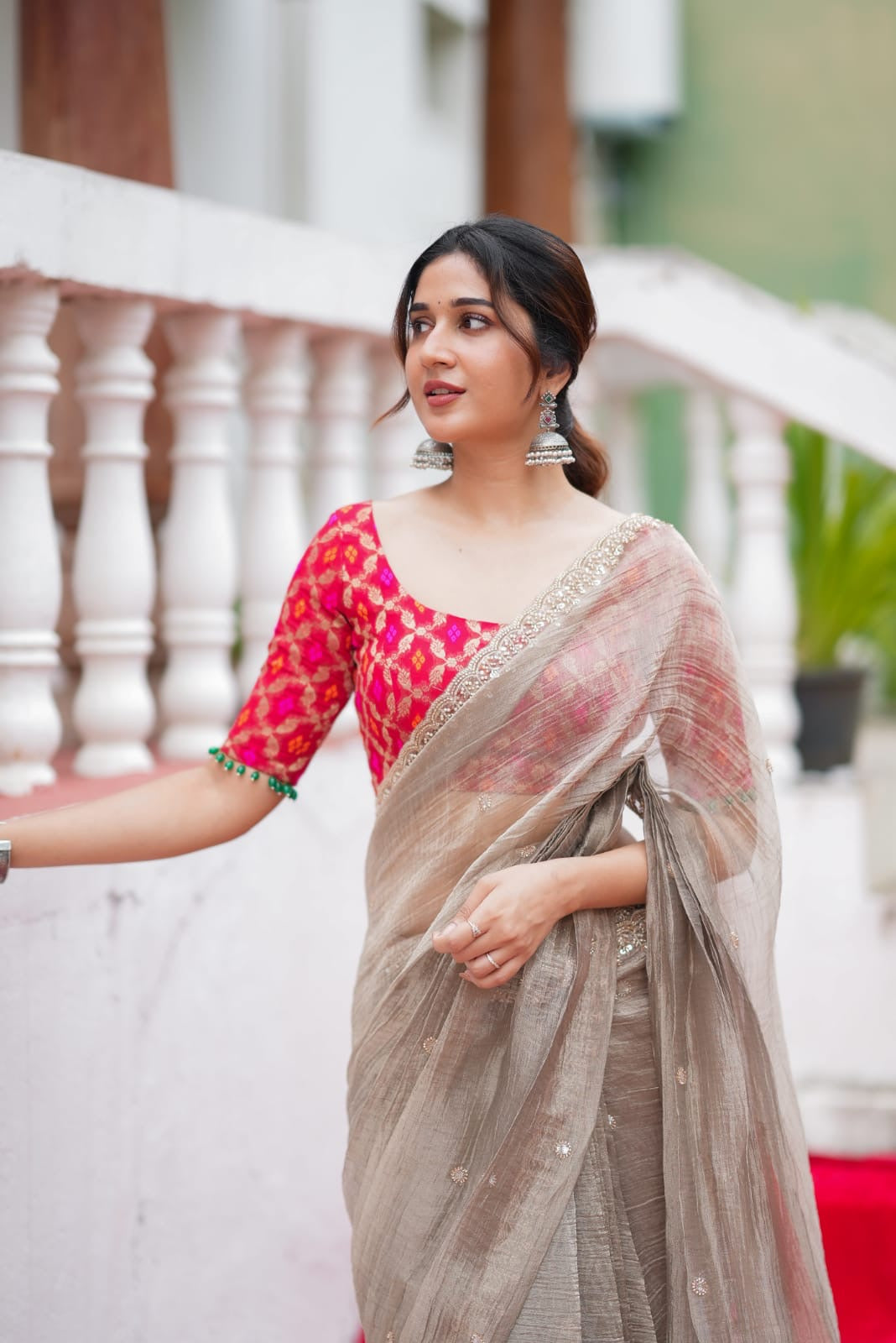 Grey tissue saree with red banarasi blouse