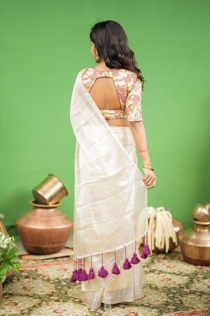 Cream soft tissue saree with embroidered blouse