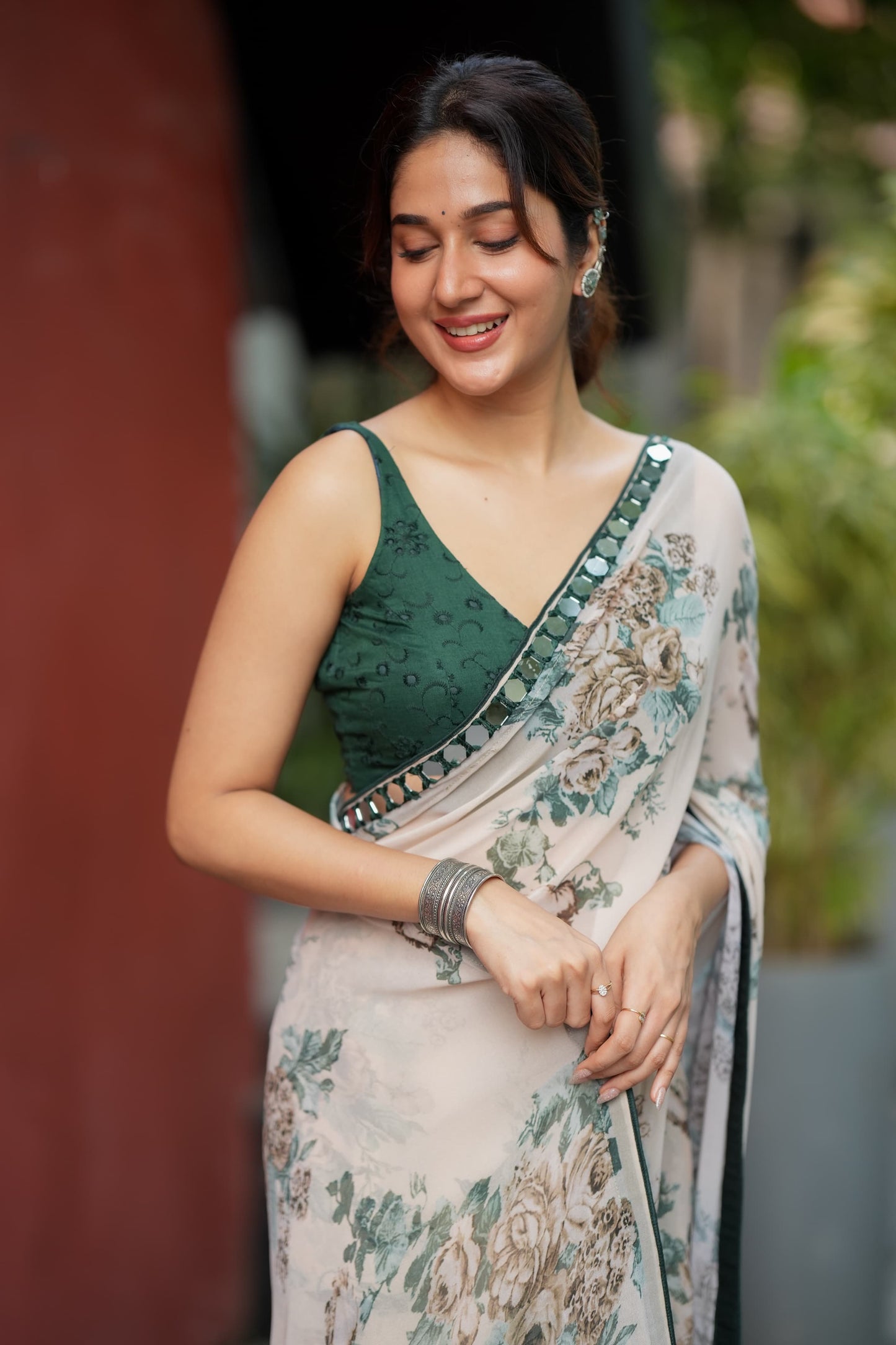 Half white chiffon floral saree with hand work blouse