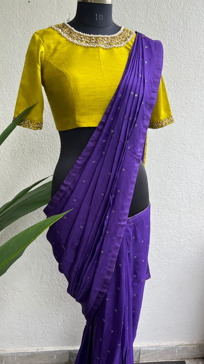 Purple soft jute saree with yellow JEWEL neck hand work blouse