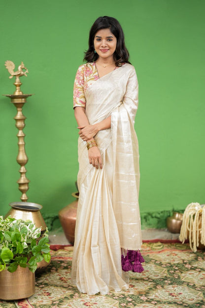 Cream soft tissue saree with embroidered blouse