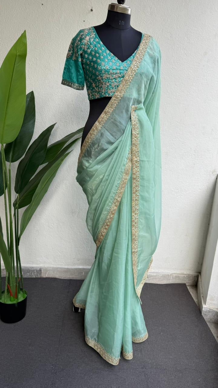 Cyan blue organza saree with blue embroidered blouse