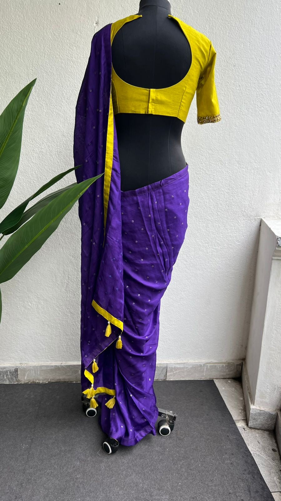 Purple soft jute saree with yellow JEWEL neck hand work blouse