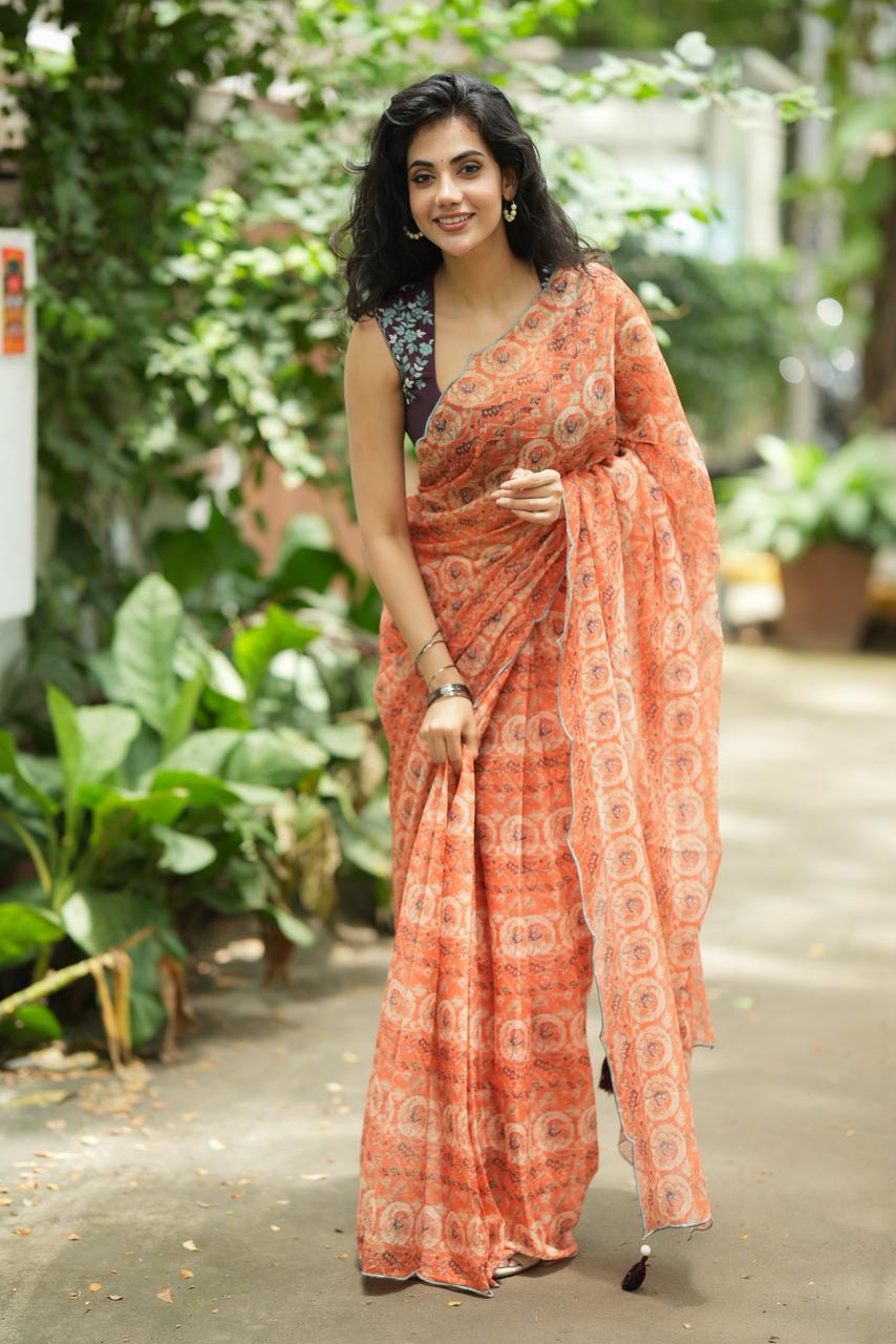 Pastel peach chiffon saree with brown hand work blouse
