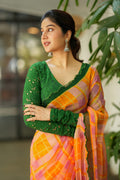 Orange viscose jute saree with green hakoba blouse