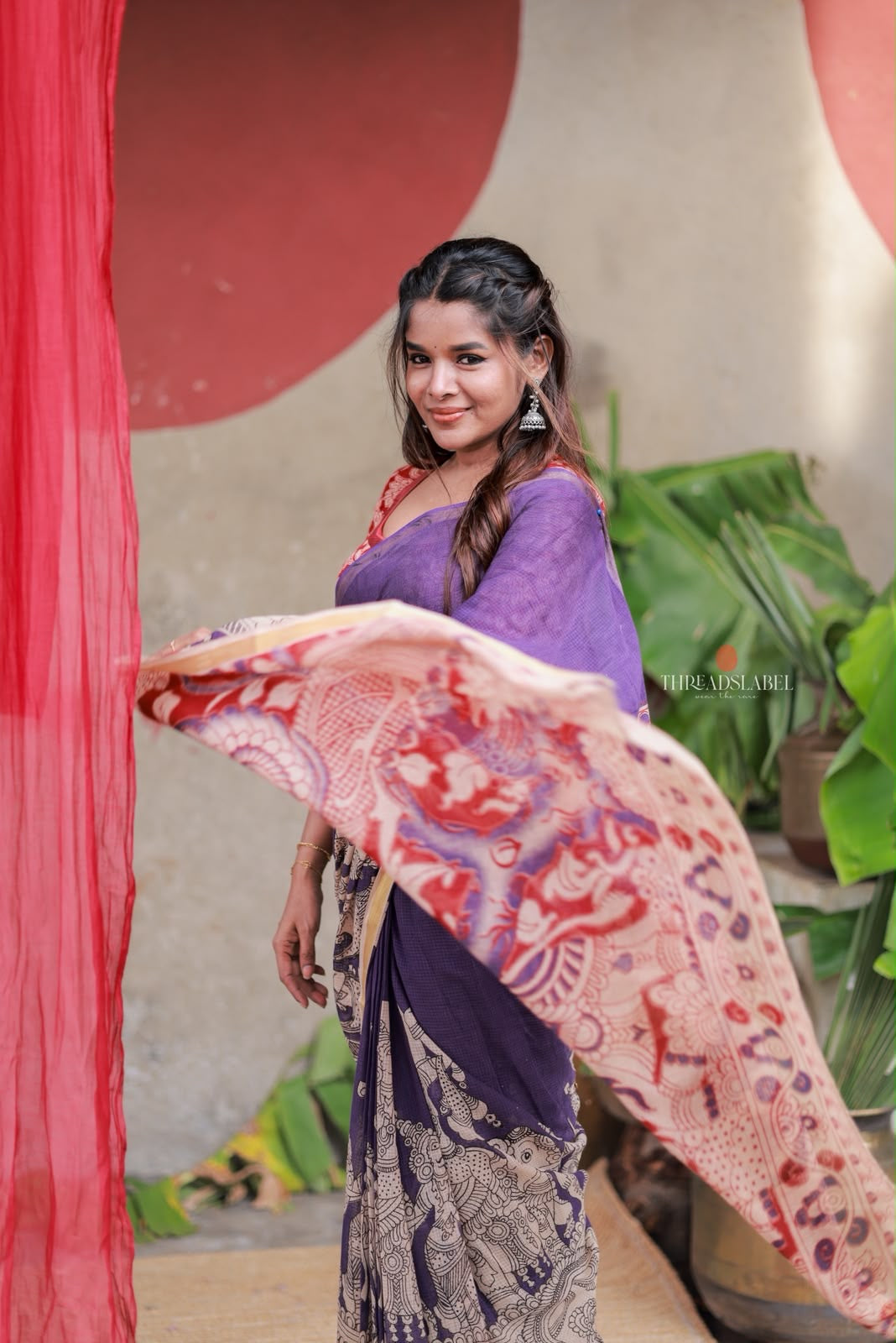 Purple kota saree with kalamkari work blouse