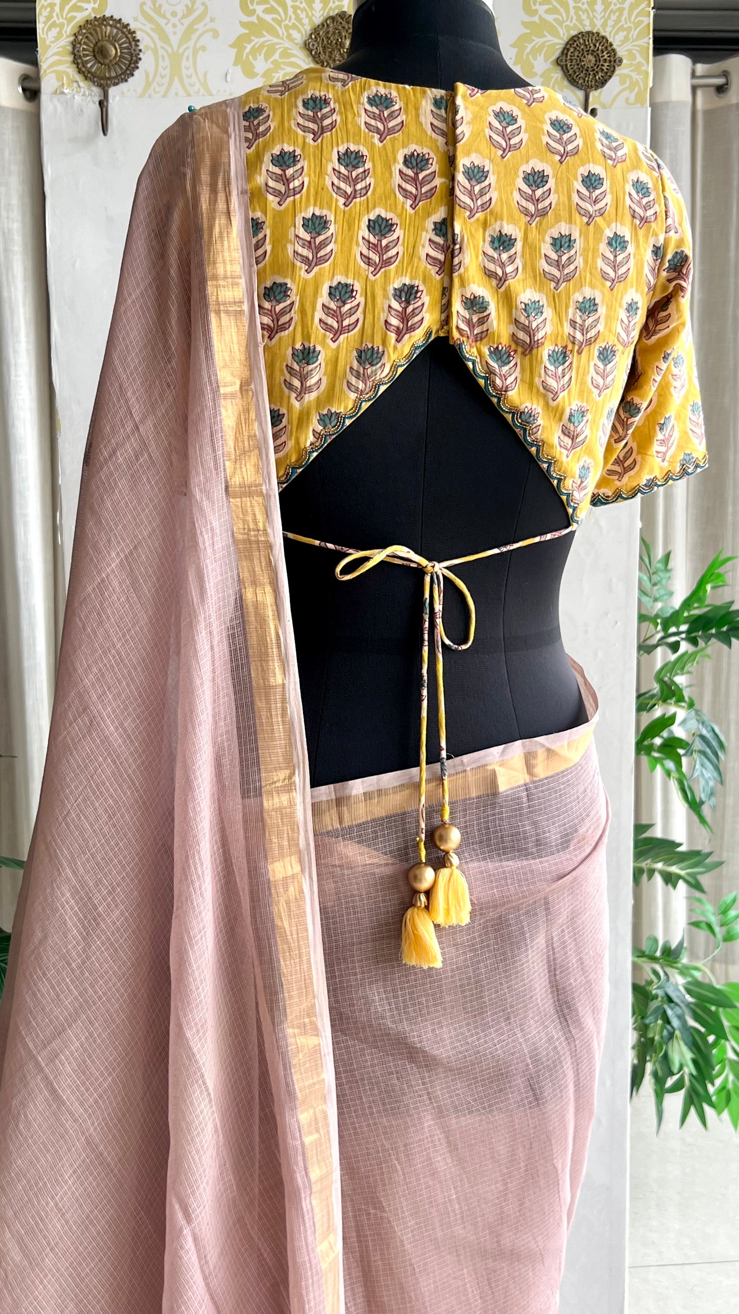 Light peach mul kota saree with yellow hand work blouse