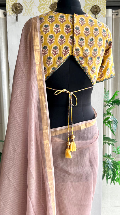 Light peach mul kota saree with yellow hand work blouse