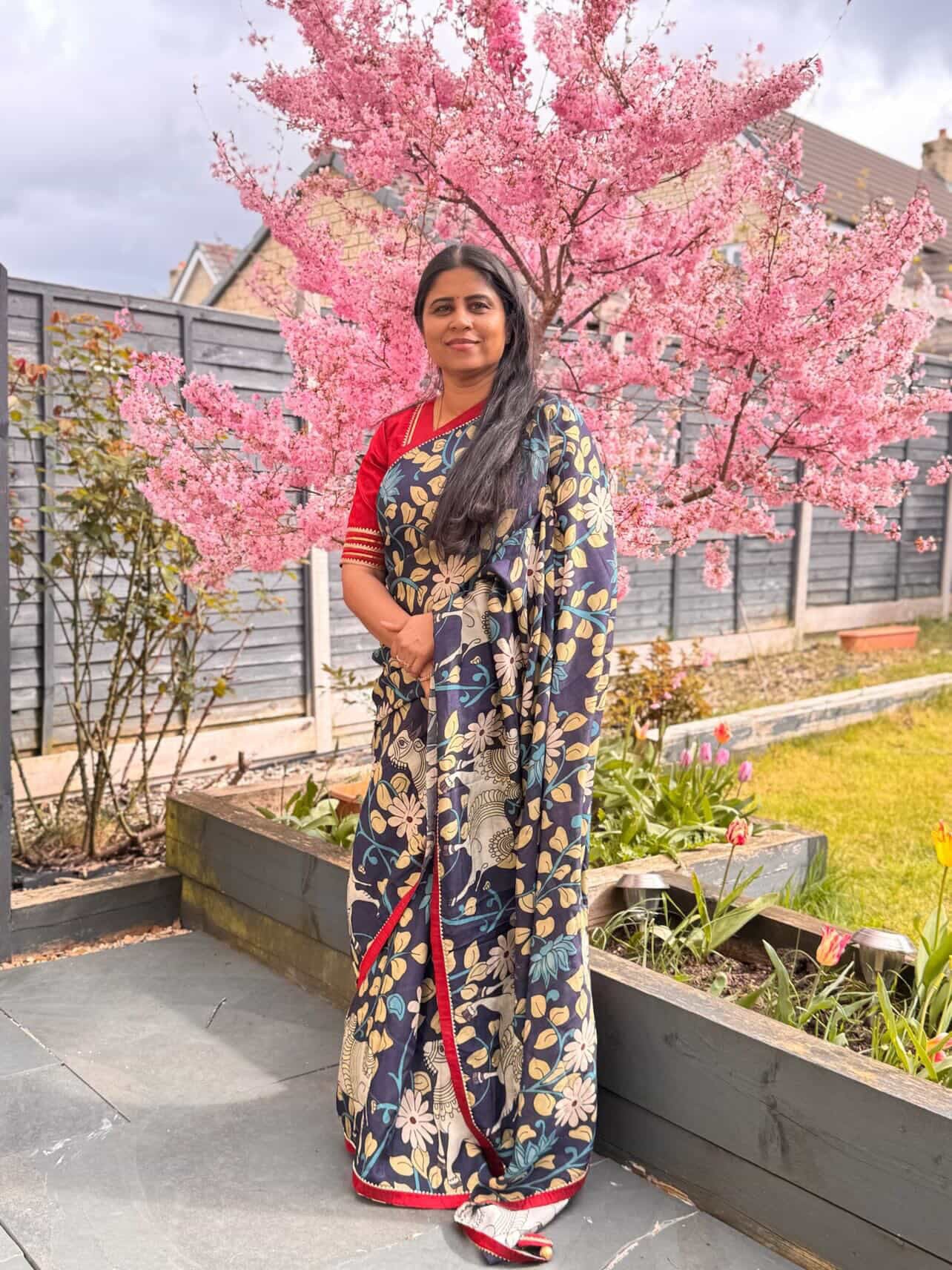 Blue dola silk kalamkari saree with maroon hand work blouse