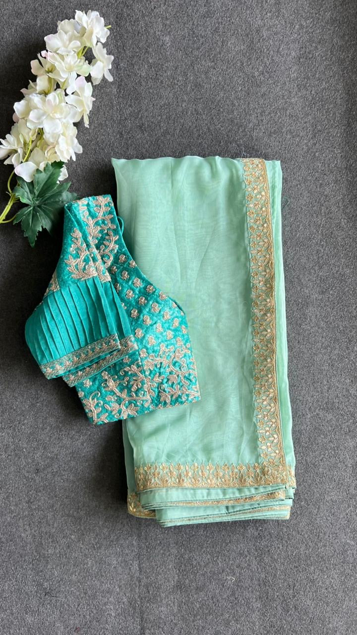 Cyan blue organza saree with blue embroidered blouse