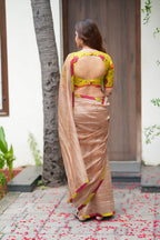 Antique gold tissue saree with parrot handwork blouse