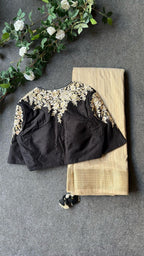 Golden cream tissue saree with black hand work blouse