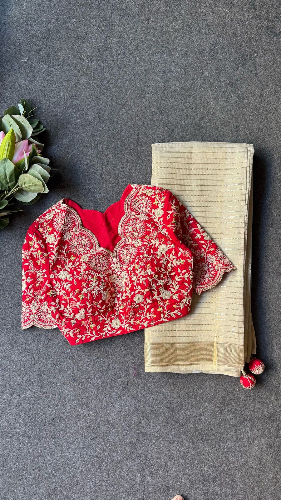 Cream tissue stripped saree with red silk hand work blouse