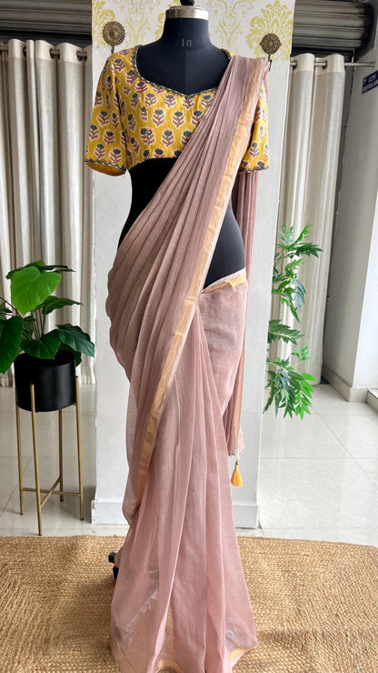 Light peach mul kota saree with yellow hand work blouse