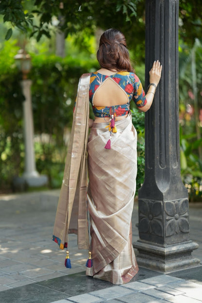 Silver soft tissue saree with blue kalamakari blouse