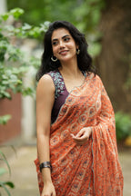 Pastel peach chiffon saree with brown hand work blouse