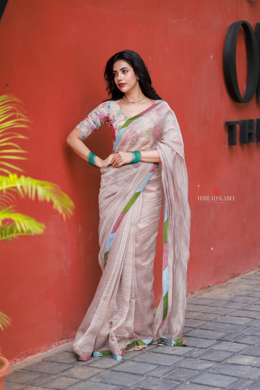 Dusty silver tissue saree with pearl hand work blouse