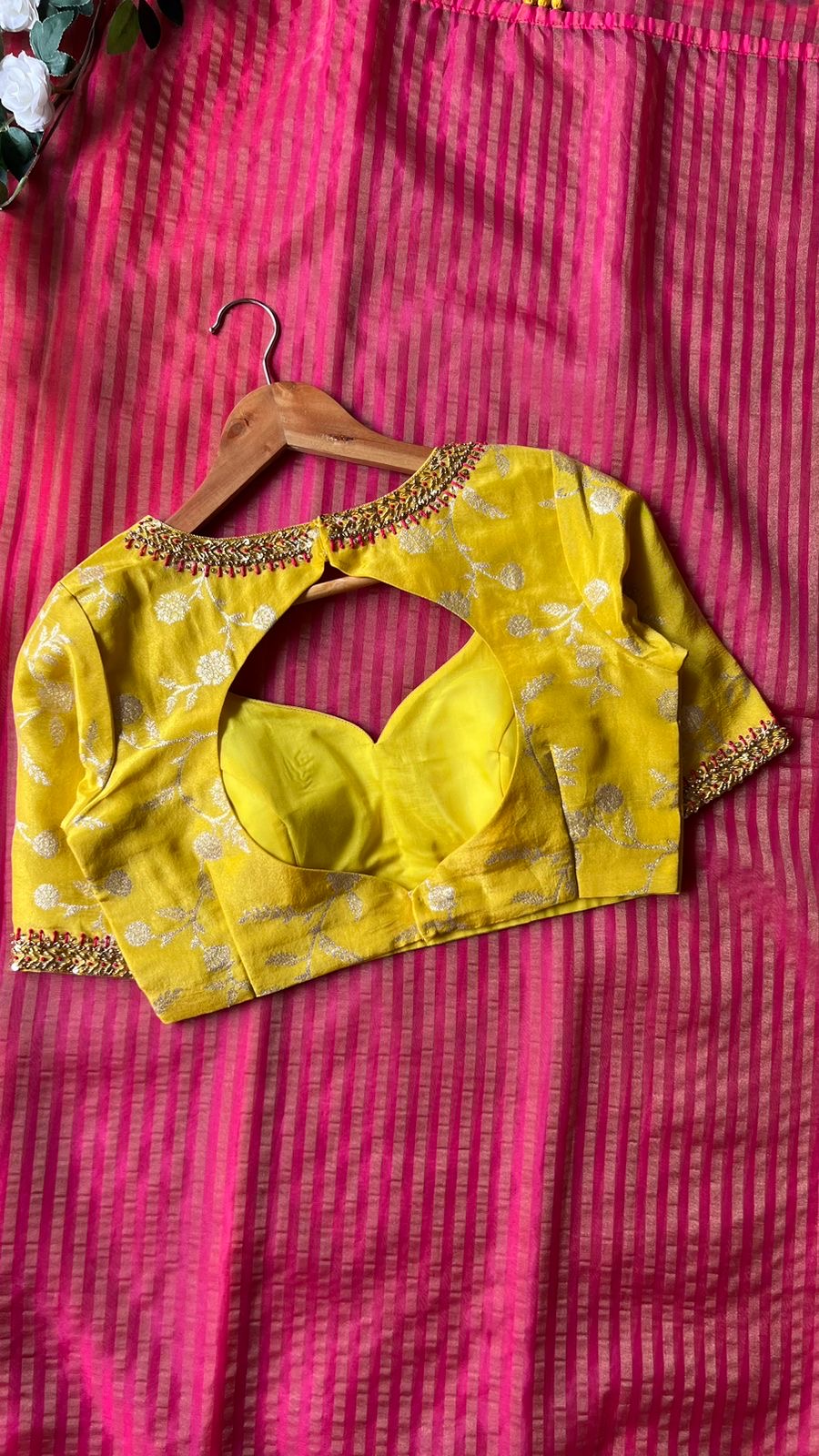 Pink stripped tissue saree with yellow floral hand work blouse