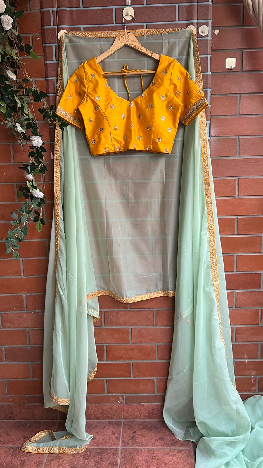 Mint organza saree with yellow embroidery blouse