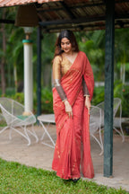 Orange rust saree with tissue handwork blouse