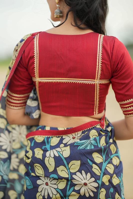 Blue dola silk kalamkari saree with maroon hand work blouse