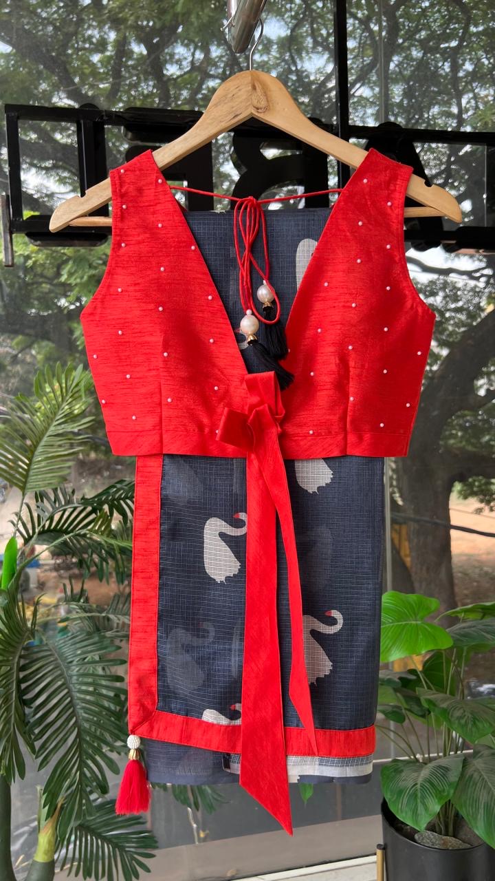 Grey kota doria saree with reddish hand worked blouse
