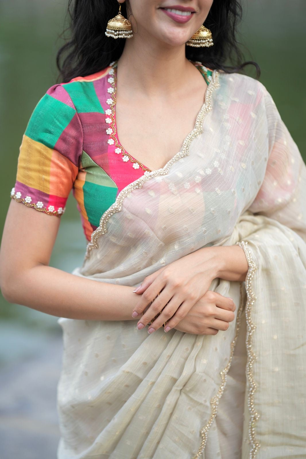 Beige georgette tissue saree with multi hand work blouse