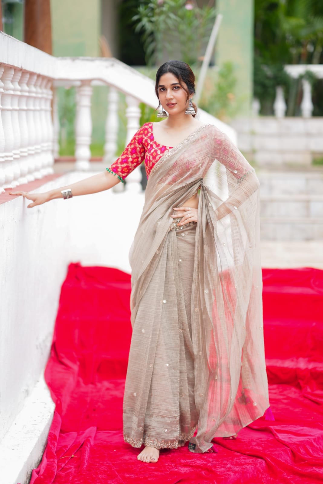 Grey tissue saree with red banarasi blouse