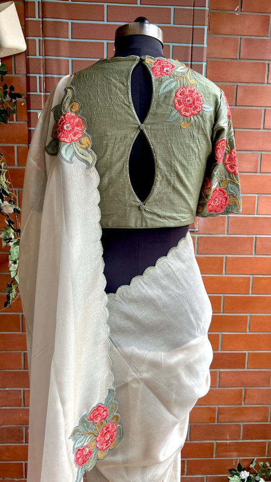 Half white textured organza saree with heavy handwork blouse