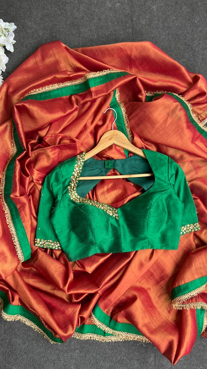 Red tissue saree with green hand work blouse