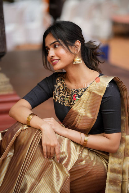 Golden tissue saree with black hand work blouse