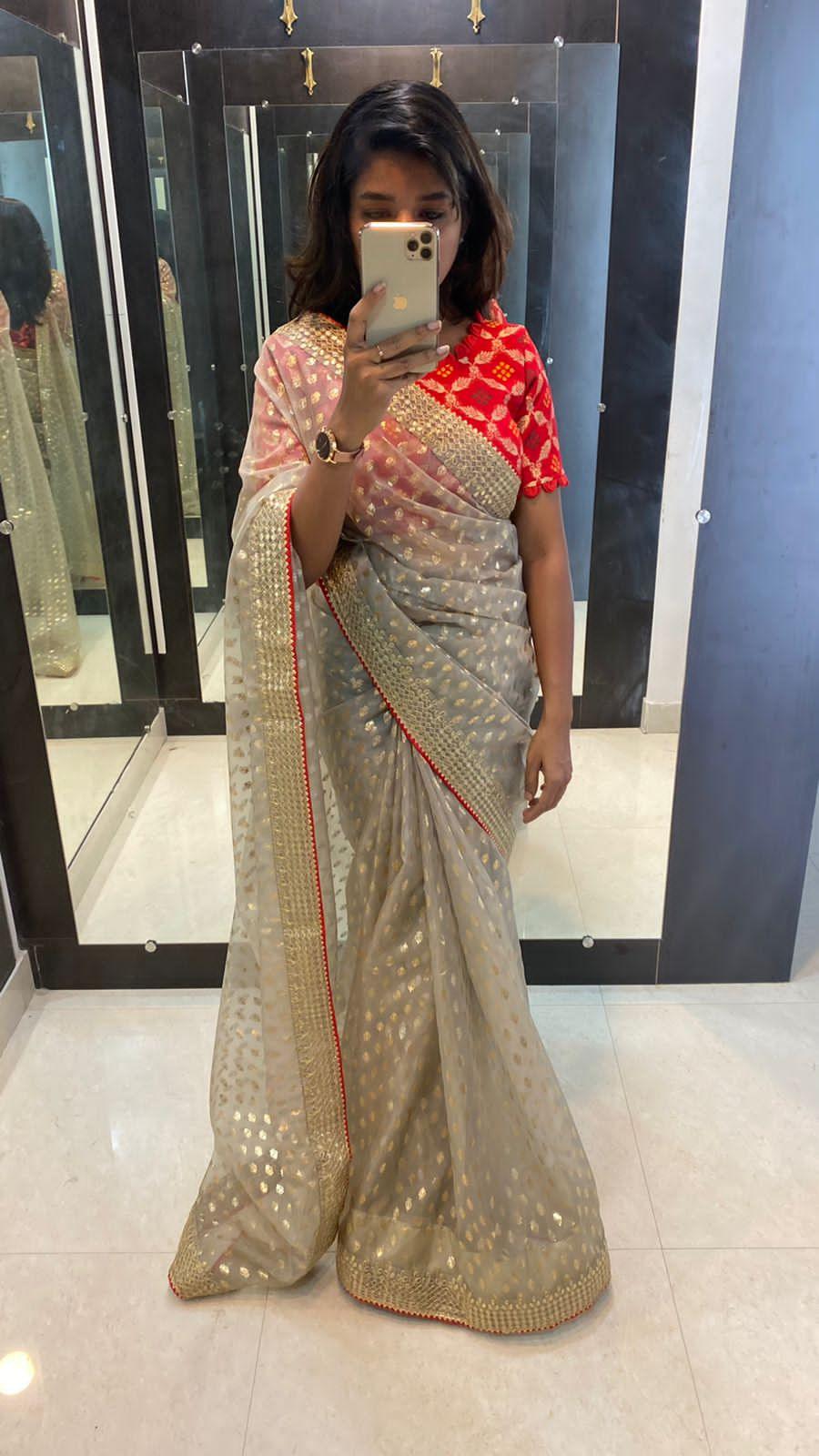 Grey organza printed saree with Stitcehd red Blouse - Threads