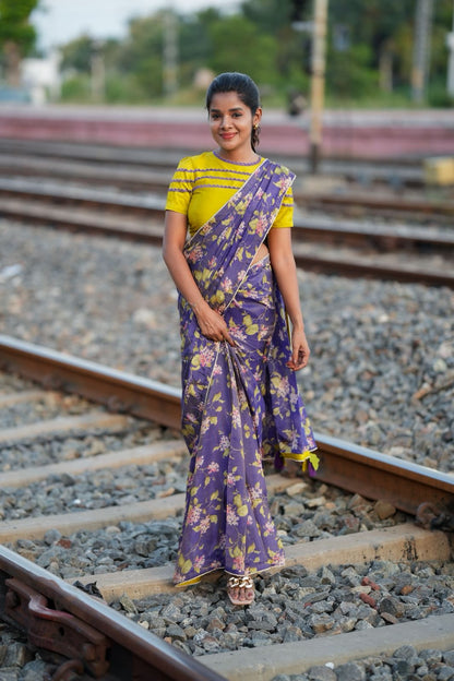 Blue floral tissue saree with lime hand work blouse