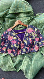 Green stripped tissue saree with purple floral hand work blouse