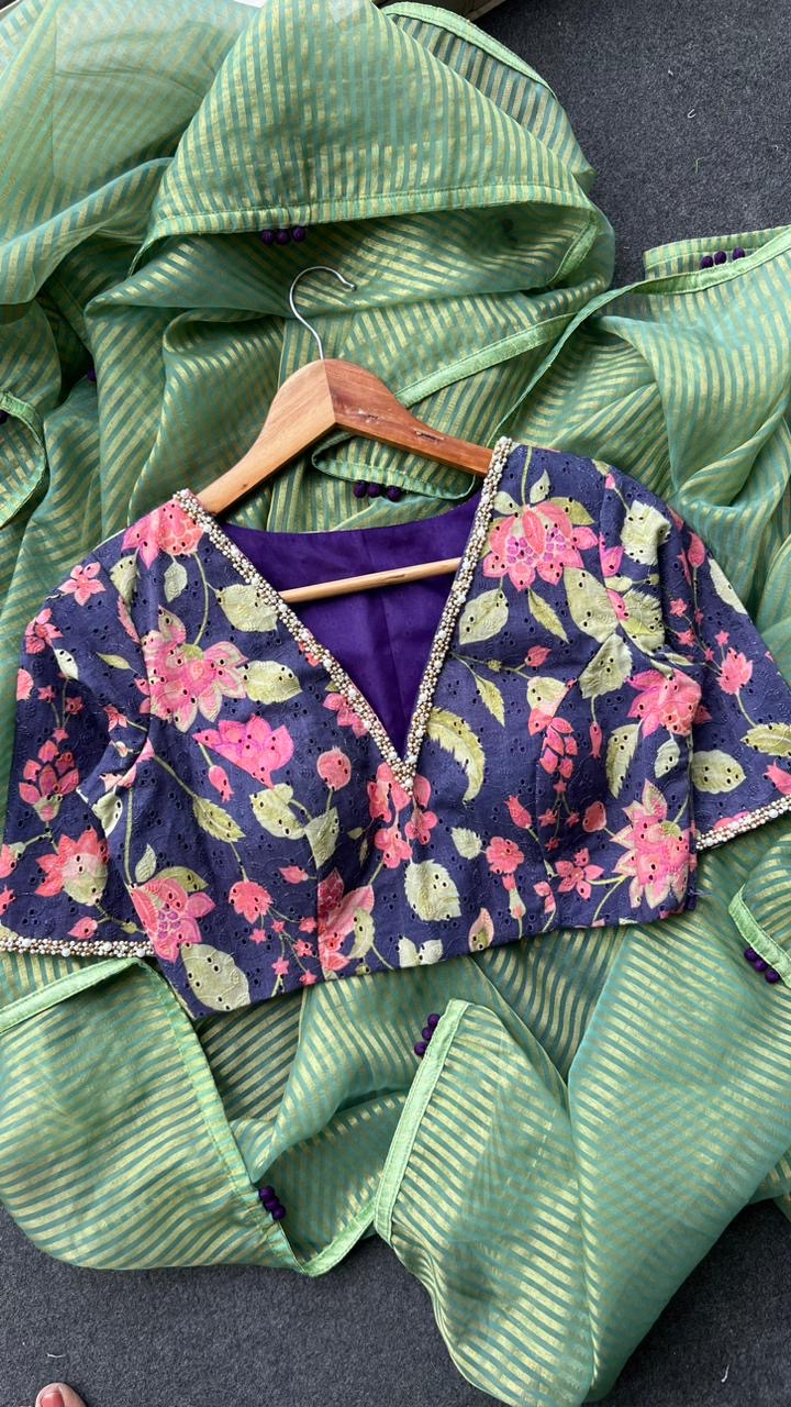 Green stripped tissue saree with purple floral hand work blouse