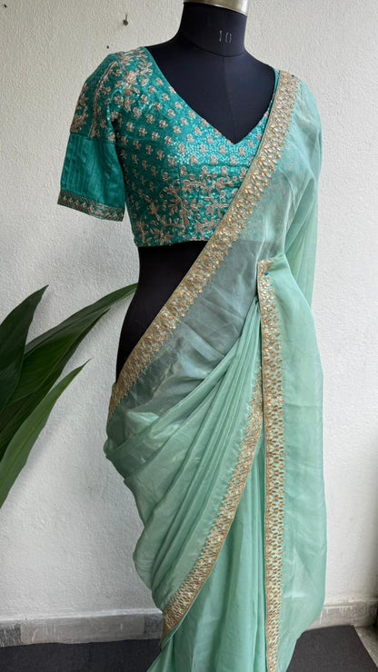 Cyan blue organza saree with blue embroidered blouse