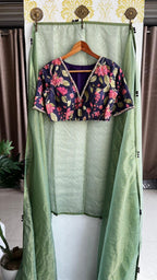 Green stripped tissue saree with purple floral hand work blouse