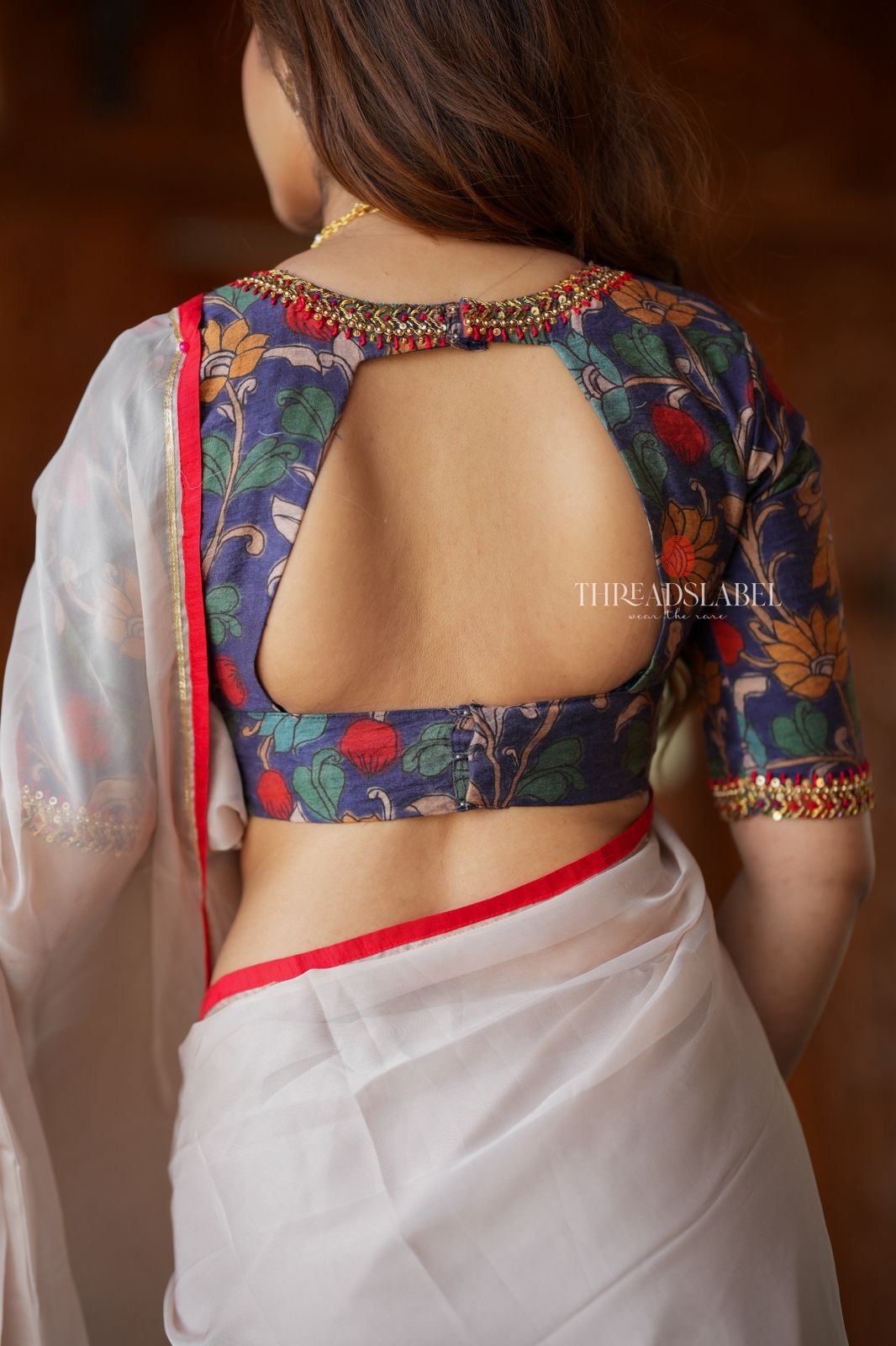 Light beige organza saree with hand work blouse